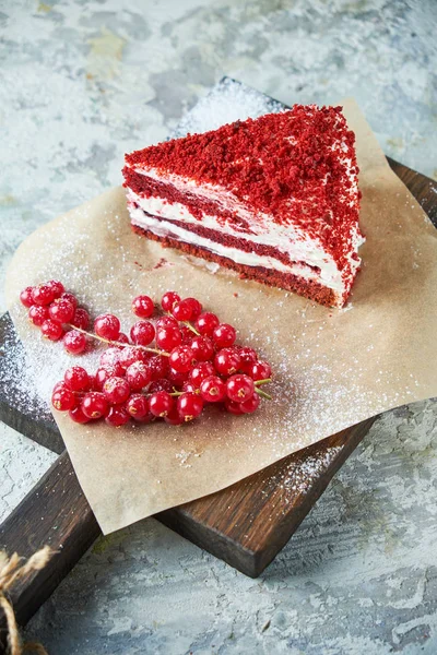 Red velvet cake. Gray textured background. Dessert. Food chain