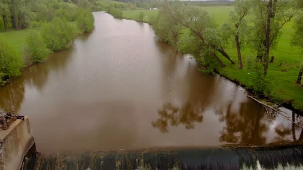 Dam on the river. Waterfall. Strong current. Aerial filming — Stock Video