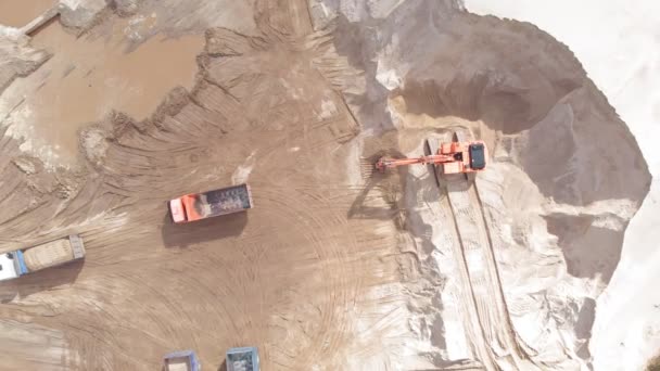 Sand quarry. Work excavator and dump truck. Aerial shooting — Stock Video