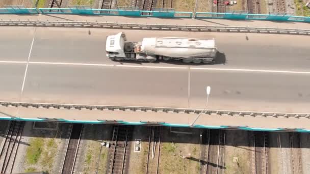 Road bridge passing over the railroad track. aerial survey — Stock Video