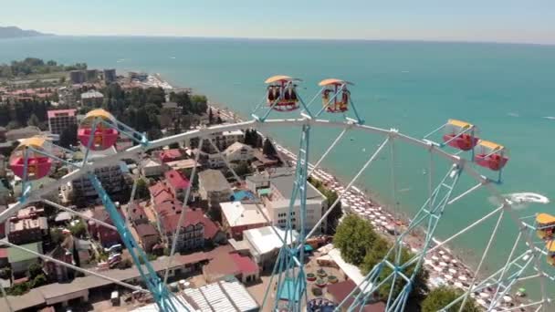 Ferris wheel on the seashore. Aerial shot — Stock Video