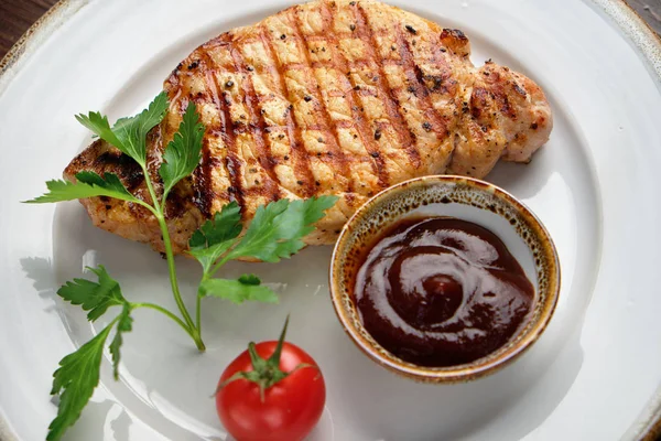 Steak on the bone with red sauce. restaurant menu — Stock Photo, Image