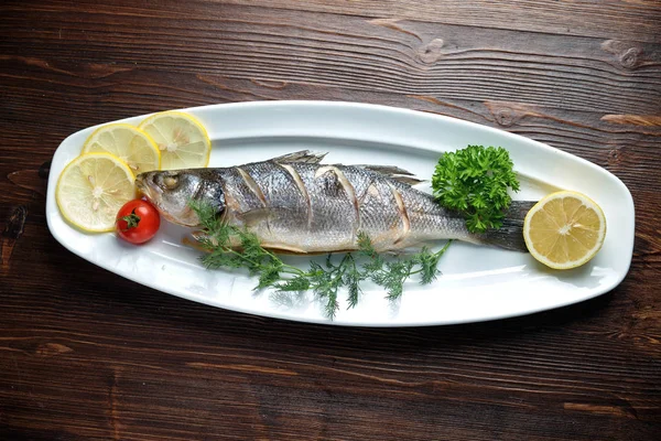 Grilled fish with a side dish and vegetables. restaurant menu — Stock Photo, Image