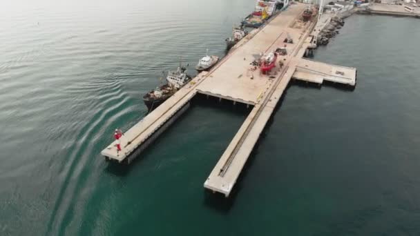 Dock for yachts and ships at sea. Aerial shot — Stock Video