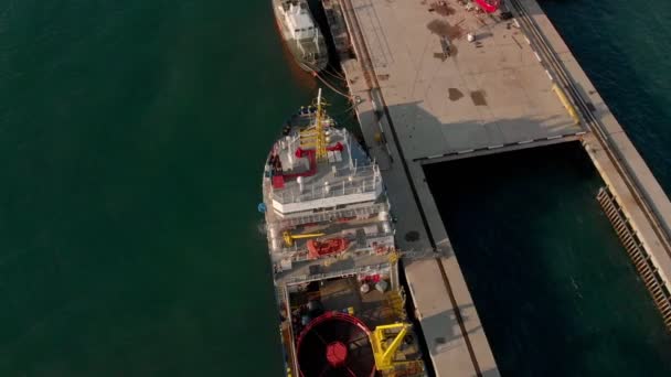 Flying over the marina and cargo port for ships in the sea. Aerial shot — Stock Video