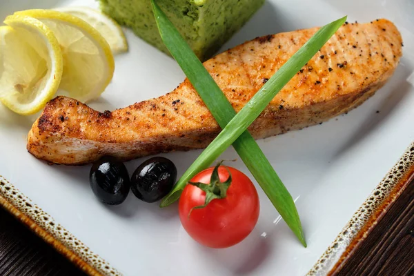 Grilled salmon steak with side dish . catering menu