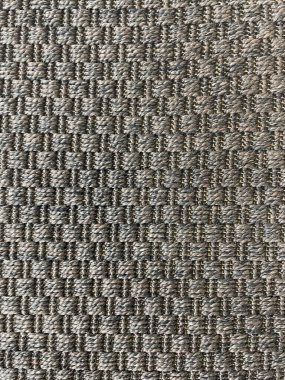 Dokuma kumaş dokusunun nötr gri ve kahverengi tonlarda yakın çekimi. Örgü desenli tekstil arka planı, tasarım, döşeme, el işi, iç dekorasyon, soyut dokular ve dijital kullanım için mükemmel..