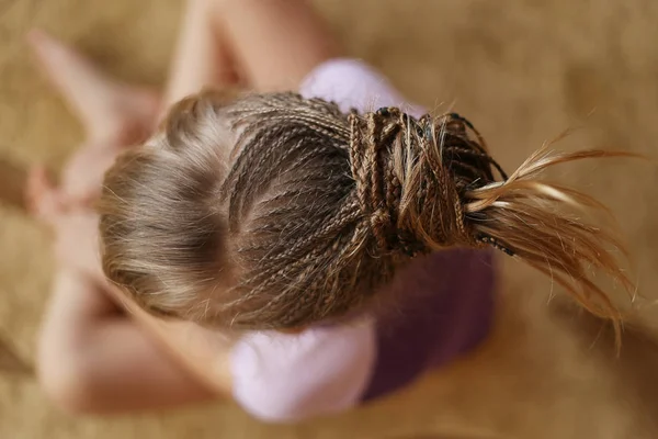 little girl with a haircut from african braids, american pigtails, thin, the work of a wizard, a hairstyle in the process of socks, background for text