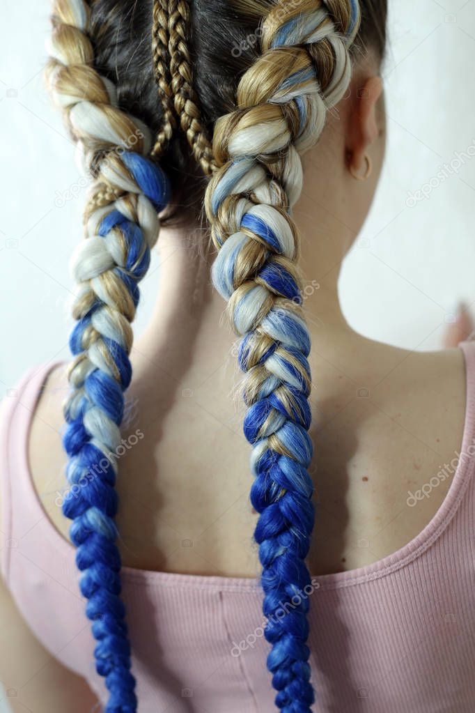 two braids of colored hair, boxing braids close-up work of a wizard hair texture, beauty salon backgrounds