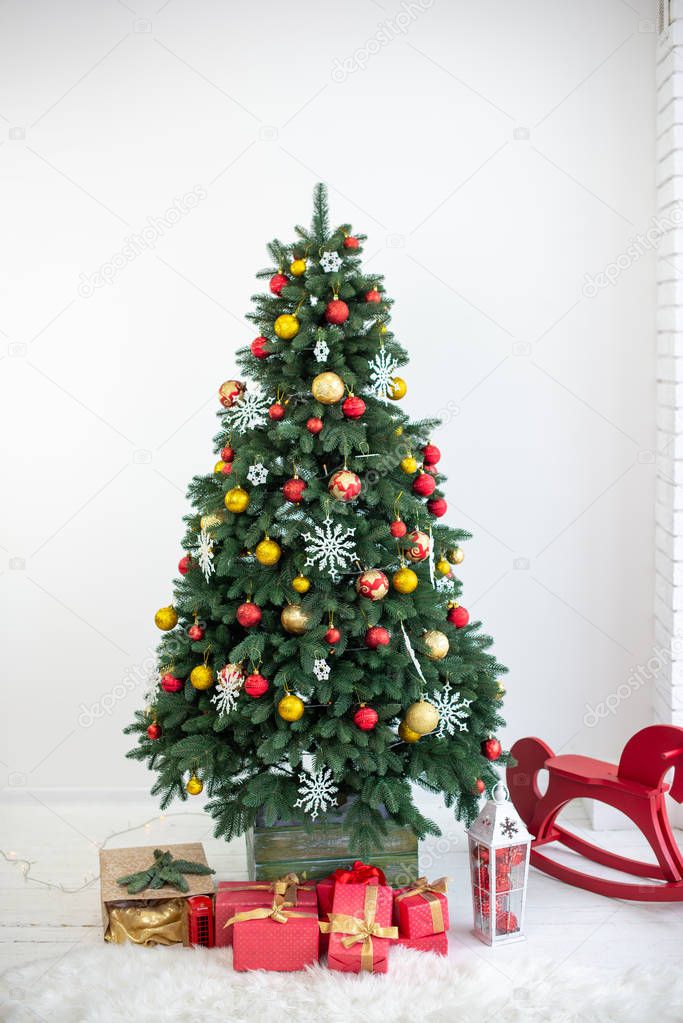 Beautiful holiday decorated room with Christmas tree and with presents. Cozy winter scene.