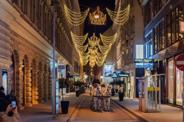 Christmas Street Decorated with Crowns clipart
