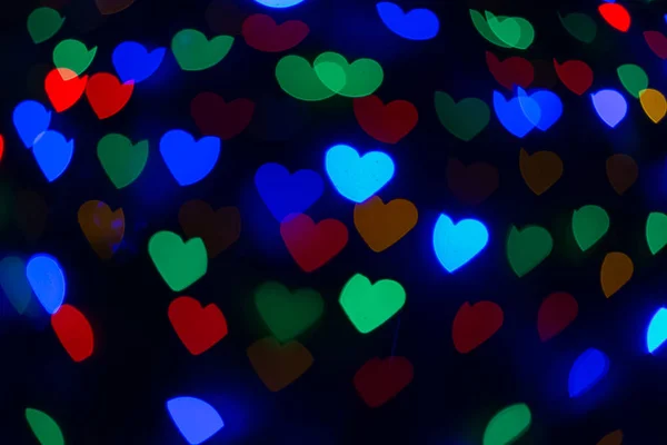 Аbstract sweet colorful heart shaped bokeh. Street light blurred background. Valentine's day and love concept Stock Picture