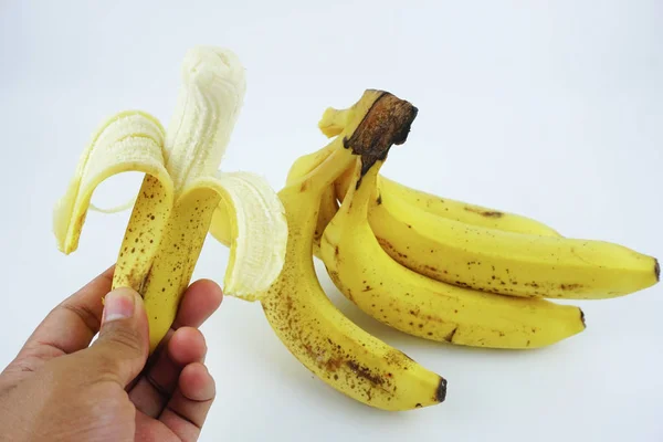 Ręka Trzyma Banan Białym Tle Zdrowe Pożywne Jedzenie — Zdjęcie stockowe