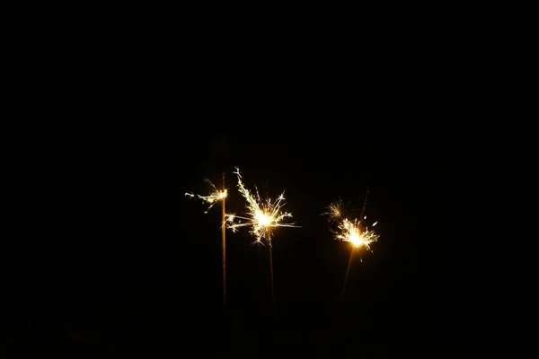 New Year Party Sparkle Fire Burn Black Background Selective Focus — Stock Photo, Image