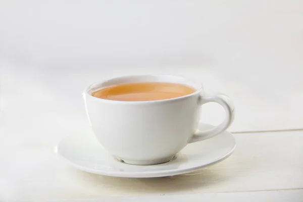 Taza Porcelana Con Verde Una Mesa —  Fotos de Stock