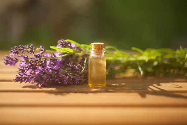 Lavender essential oil in  beautiful bottle on table — Stock Photo, Image