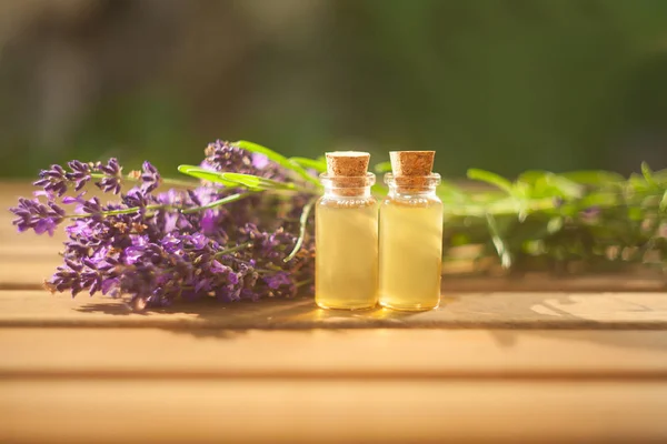 Lavender essential oil in  beautiful bottle on table — Stock Photo, Image