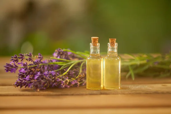 Lavender essential oil in  beautiful bottle on table — Stock Photo, Image