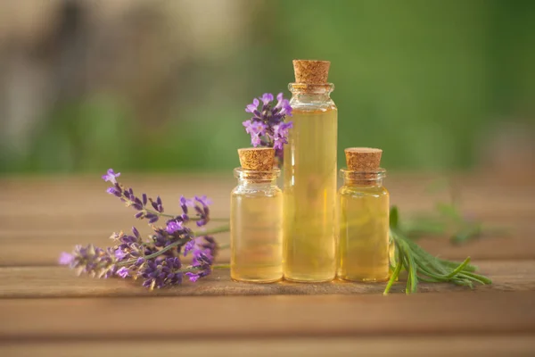 Lavender essential oil in  beautiful bottle on table — Stock Photo, Image