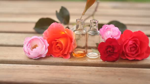 Essence Rose Table Beautiful Glass Bottle — Stock Video