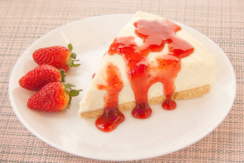 delicious cheesecake with strawberries on a plate