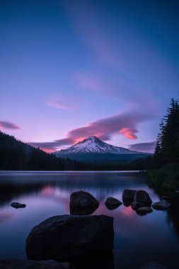 Summer sunset over Trillium Lake and Mt Hood clipart
