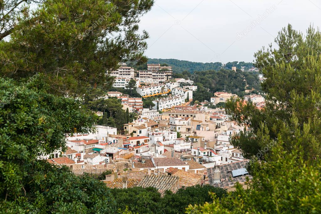 City view from the mountains. The town of Tossa de Mar from above. City on the mountain. City from the top of the fortress. Temple in the city.