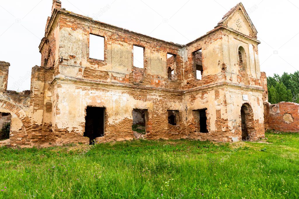 The ruins of a monastery founded by the Sapieha family at present. Summer 2020, Biaroza, Belarus. Brick destroyed walls. Reconstruction is not underway.