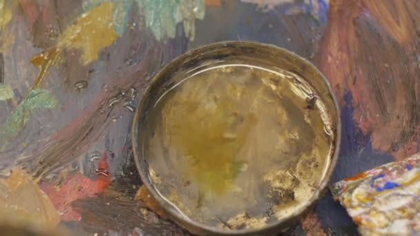 Artist paints in studio. — Stock Video