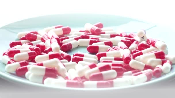 Red pill slow motion ,close-up — Stock Video