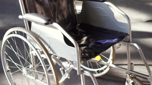 Wheelchair close up. Steady shot — стоковое видео