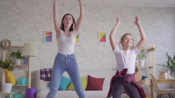 Mother and daughter doing warm-up slow mo — Stock Video