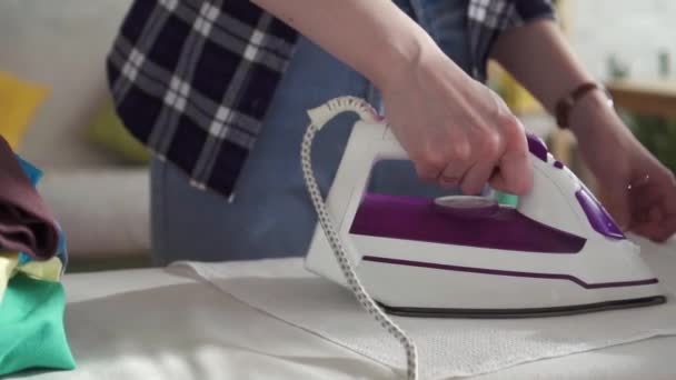 Womens hand Ironing close-up of slow mo — Stock Footage Womens hand Ironing close-up of slow mo Royalty Free Stock Video