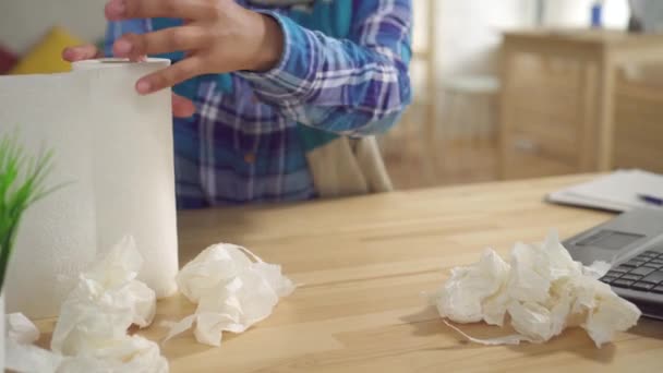 Portrait tired African American young woman with Afro hairstyle with scarf on neck is sick sneezes Allergy or cold using paper napkins sitting at the table in the living room — Stock Video