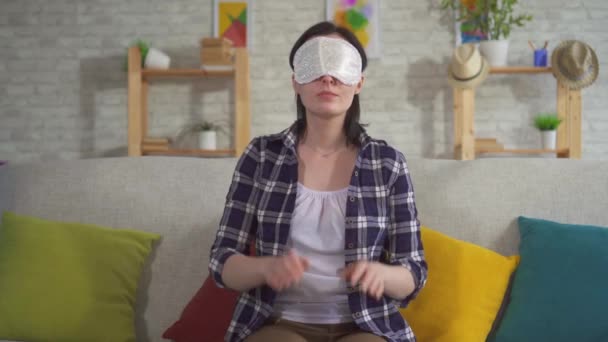 Young woman sleeping in a sleep mask — Stock Video