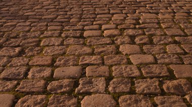 Sokak taşı kaldırım dokusu. Eski Arnavut kaldırımlı arka plan