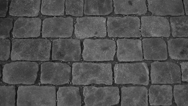 Piedra textura pavimento blanco y negro. fondo adoquinado — Foto de Stock