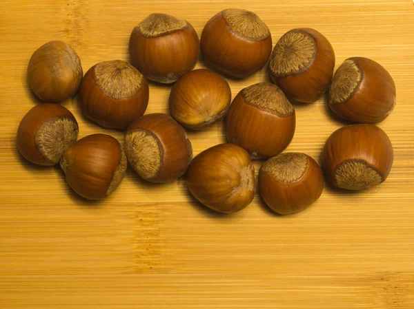 Hazelnuts on a wooden background closeup — Stock Photo, Image