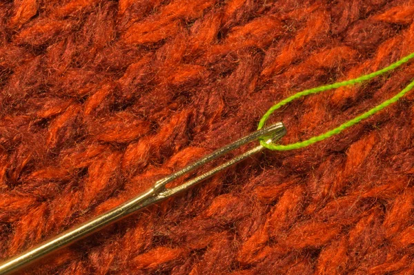 Needle with thread macro on textile background — Stock Photo, Image