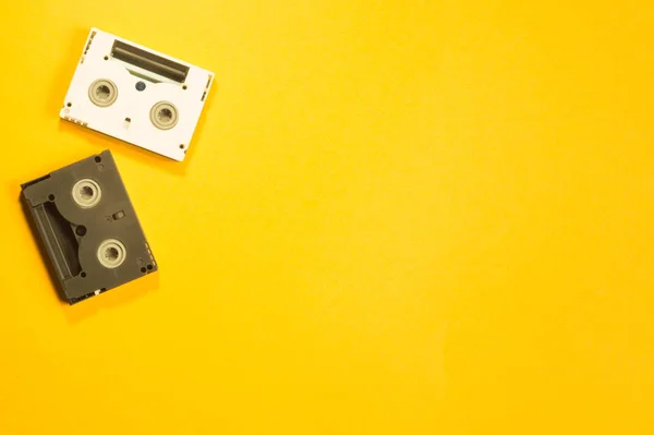 Digital video cassette on yellow background. mini dv cassette — Stock Photo, Image
