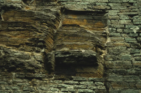 Hermoso fondo de pared rocosa. textura grunge abstracta. piedra ladrillo pared mampostería —  Fotos de Stock