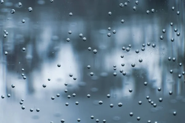 Burbujas de agua macro. burbujas en un recipiente. naturaleza telón de fondo — Foto de Stock