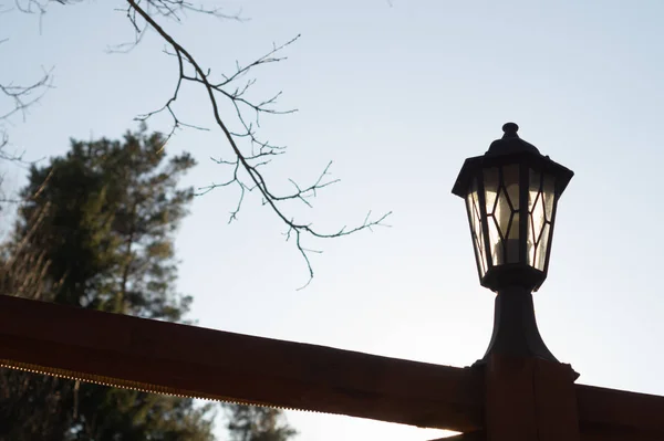 Retro street lamp at sunset. Vintage lantern at evening light — Stock Photo, Image