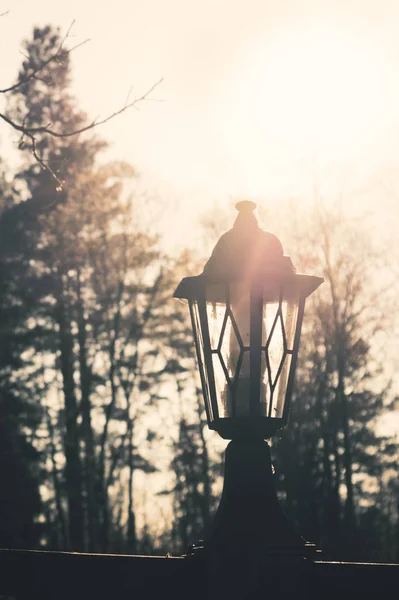 Retro street lamp at sunset. Vintage lantern at evening light