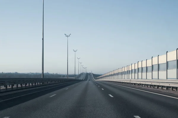 Wide highway. long roadway. road going into the distance