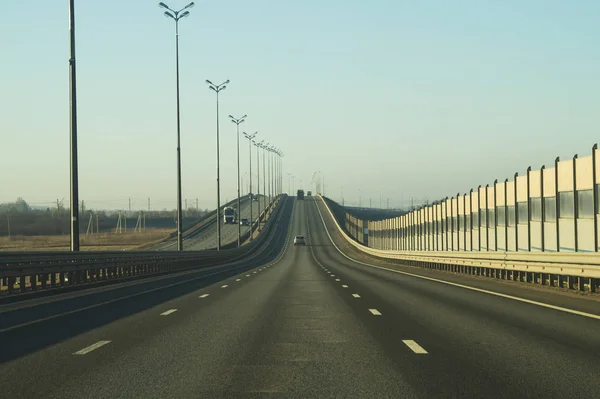 Wide highway. long roadway. road going into the distance