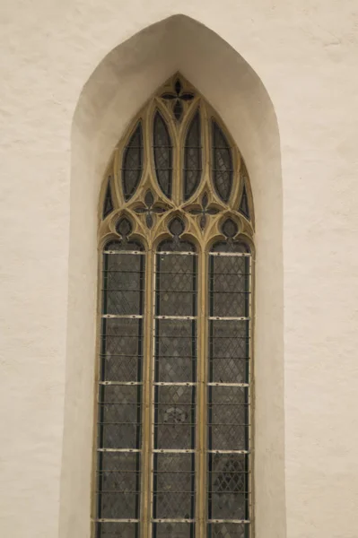 Unusual window on the facade of the old house — Stock Photo, Image