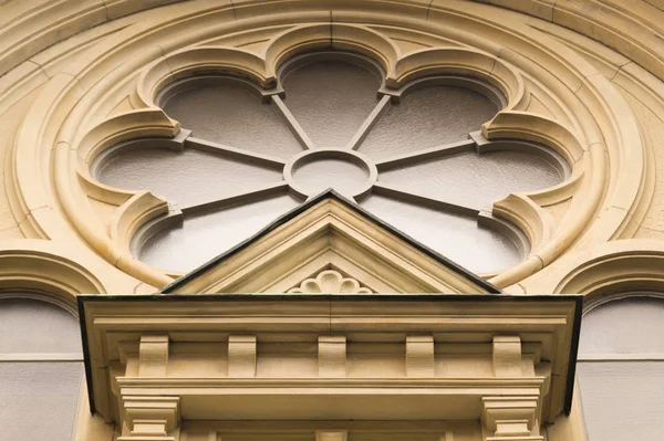 Unusual window on the facade of the old house — Stock Photo, Image