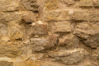 Kayalık tuğla duvar. taş duvar arka plan. soyut grunge doku. eski kahverengi duvar