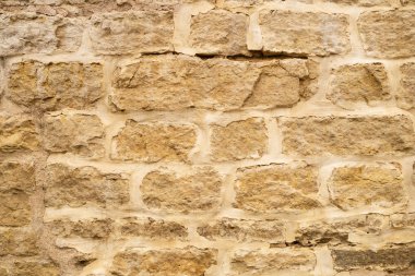 Kayalık tuğla duvar. taş duvar arka plan. soyut grunge doku. eski kahverengi duvar